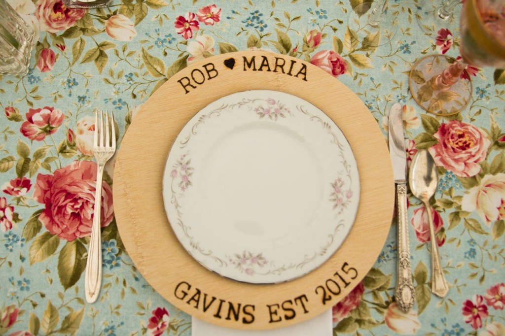 vintage wedding tableware with antique dishes, flatware and rose goblets. A personalized woodburned dinner plate is the perfect touch!