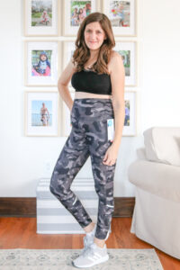 Burn Fat and Feast "before" photo of woman wearing activewear in living room