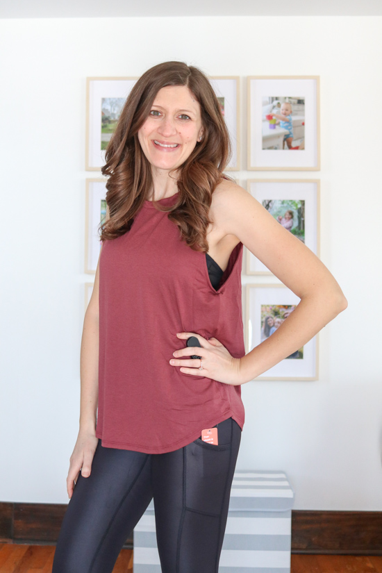 woman wearing merlot colored electric tank with shiny black leggings from Wantable