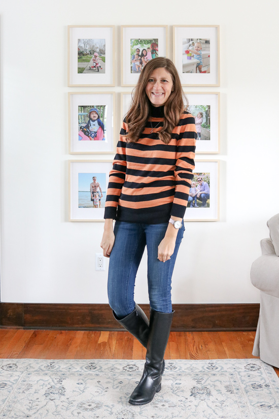 Amazon Essentials black and orange stripe Lightweight Mockneck Sweater with jeans and black riding boots